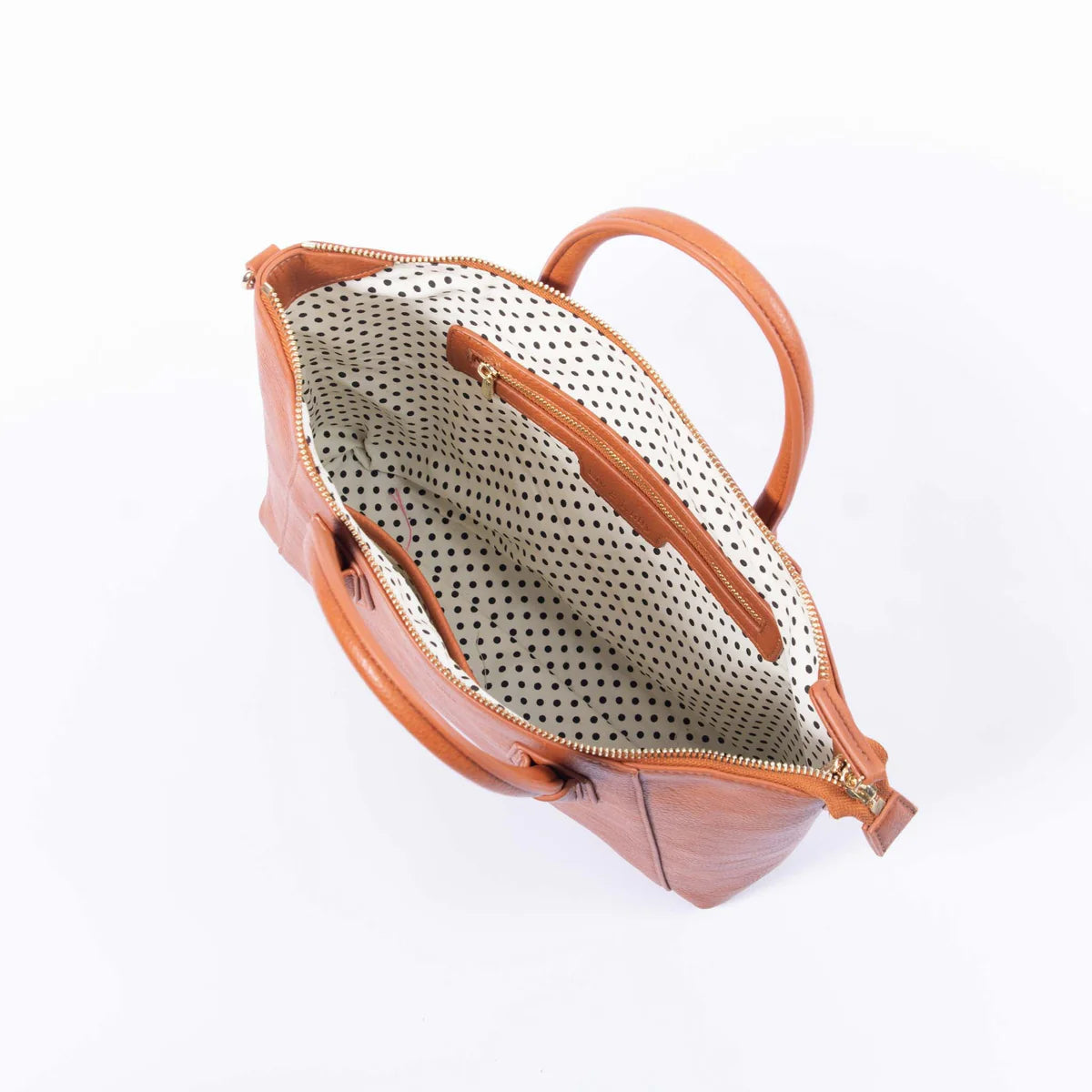The Charlotte is an exquisitely crafted vegan leather handbag that will truly make a statement. Its tan colour gives it a luxurious and timeless look; ideal for any occasion.