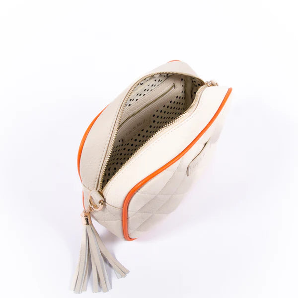 The Liv & Milly Sally in Cream/Orange is a classic & versatile crossbody bag crafted from a gorgeous soft vegan leather.