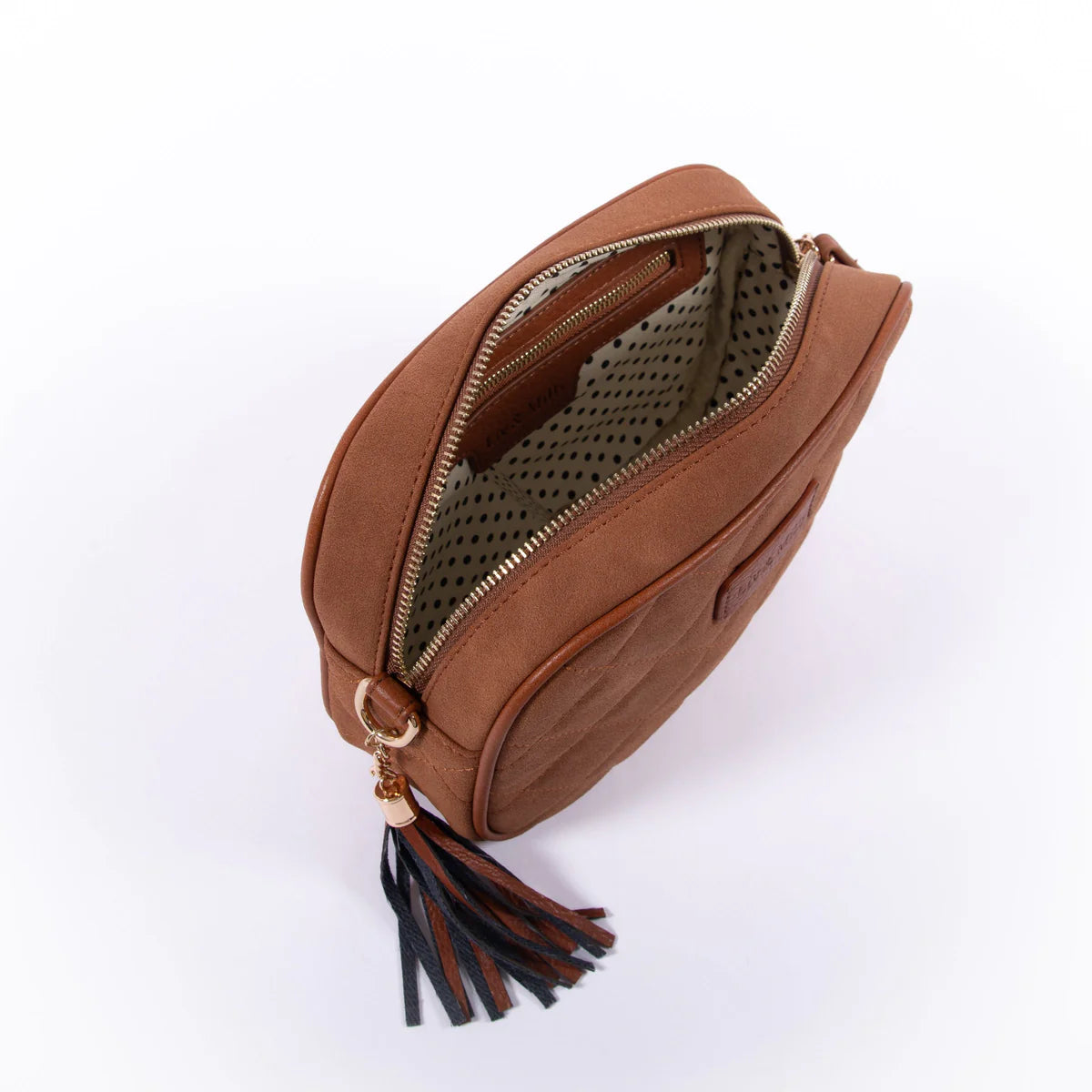 The Liv & Milly Sally Quilted Crossbody in Tan Suede is a classic & versatile crossbody bag crafted from a gorgeous soft vegan leather.