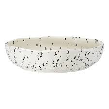 The organic-shaped pieces of the Speckle Polka range feature a matte glaze with a dimpled, tactile finish.
