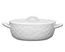 The organic-shaped serving pieces of the Speckle Milk range feature a soft speckle and dimpled tactile finish.