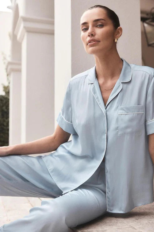 The Aileen Blue Satin Crop Pant PJ is an elegant and luxurious loungewear set that combines comfort with a touch of sophistication, making it perfect for relaxing in style.