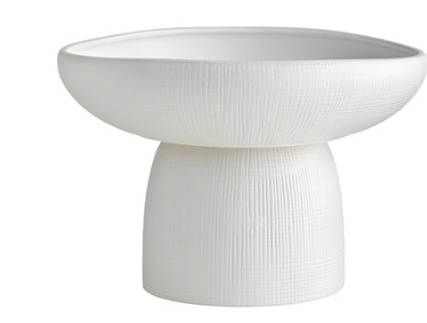 Borrowing cues from the unpredictability of the sea, Bisque proudly displays asymmetrical, waved edges as the defining feature of this capsule collection